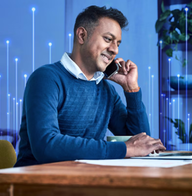 Man conversing on a smartphone with overlay of OpenBlue graphics