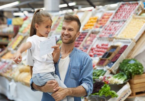 Father And His Daughter In A Supermarket